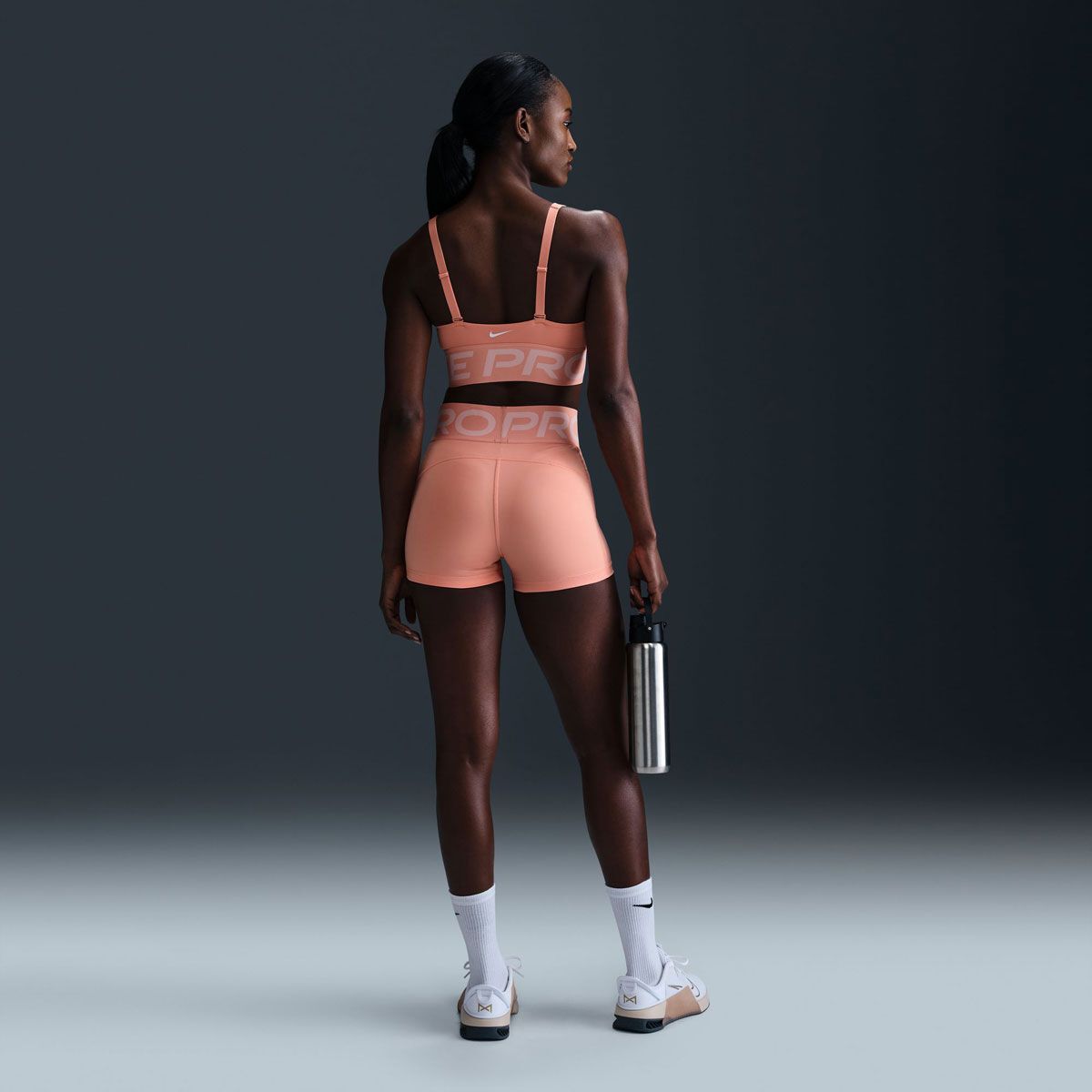 Nike Pro Womens Indy Dri-FIT Plunge Medium Support Padded Sports Bra - Apricot slider